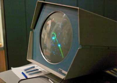 The PDP1's circular display running Spacewar!